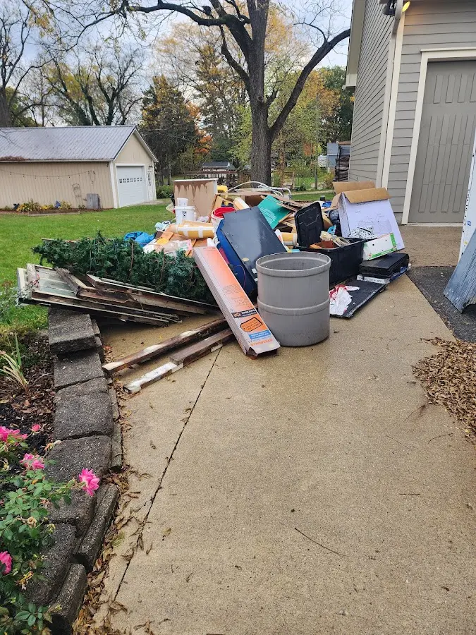 Dumpster being loaded with debris for 3 Yard Dumpster Rental in Lake Wilderness